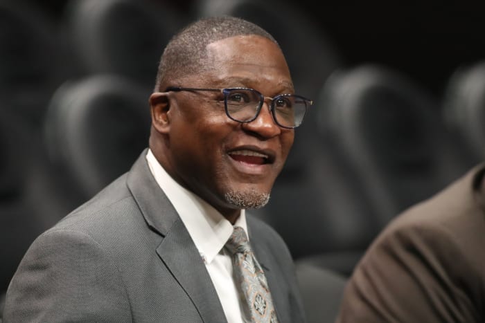 Mar 9, 2020; Atlanta, Georgia, USA; NBA Hall of Fame player Dominique Wilkins talks with Atlanta Hawks staff before the Hawks' game against the Charlotte Hornets at State Farm Arena.